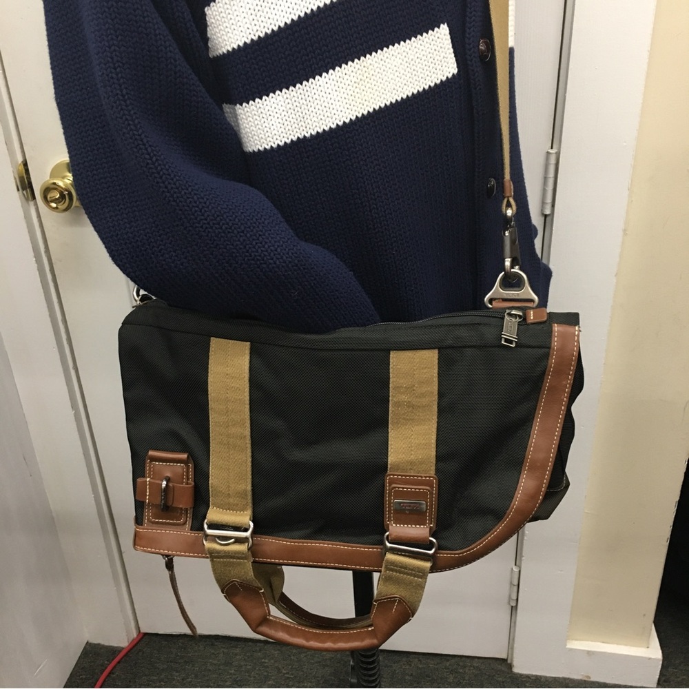 TUMI canvas and leather travel bag.